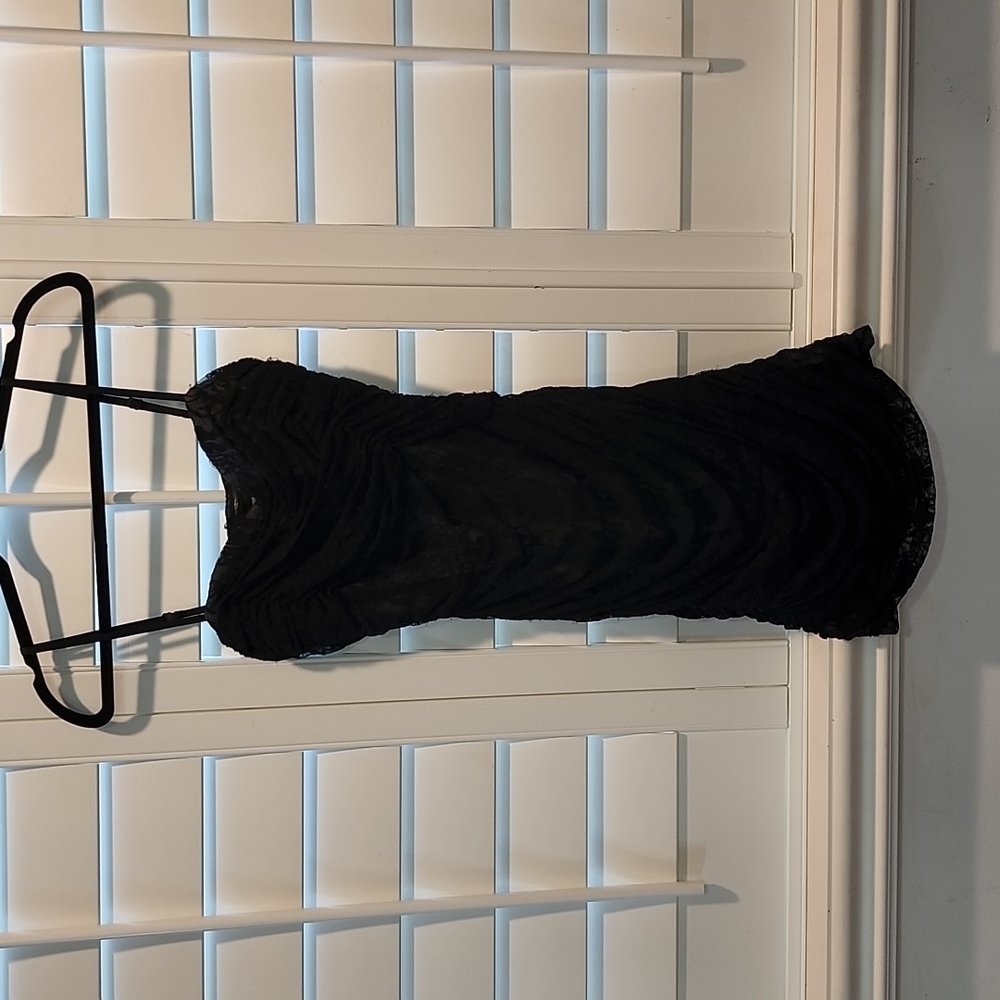 Black laceshort dress spaghetti straps side zip. Ruching on both sides.  Marc